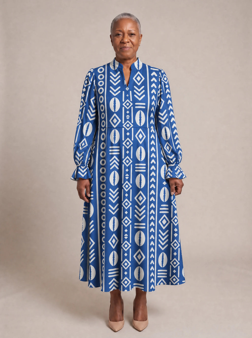 "Oshun" Royal Blue Long Puff Sleeve Dress — standing, angled view on model