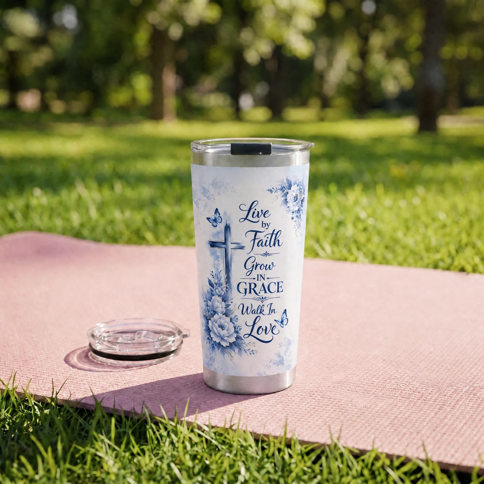 "Neema" Tumbler — on a yoga mat on a park lawn