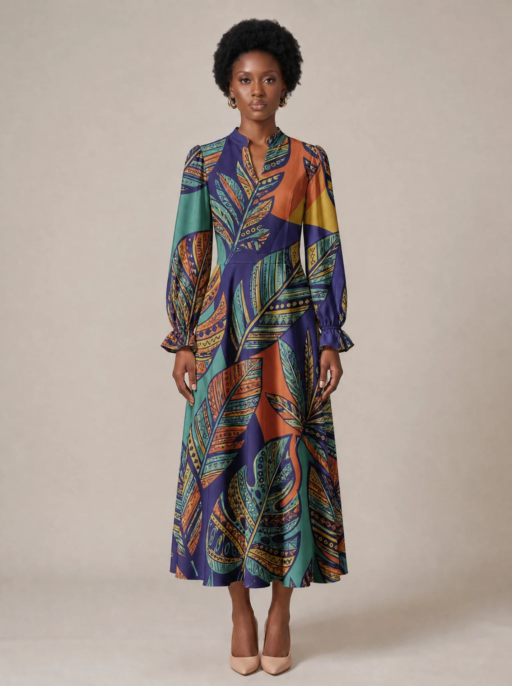 "Majani" Long Puff Sleeve Dress — standing, angled view on model