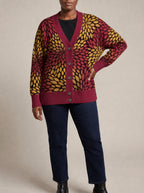"Mavuno" Knitted Cardigan — close view of the V-neck, buttons and ribbed trims