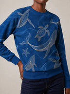 "Pwani" Sweatshirt — close view of the crew neck, raglan seams and ribbed trims