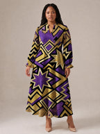 "Sheba" Long Puff Sleeve Dress — standing, angled view on model