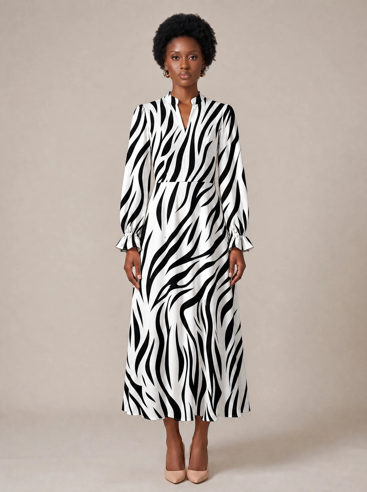 "Milia" Long Puff Sleeve Dress — standing, angled view on model