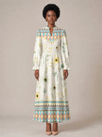 "Alizeti" Long Puff Sleeve Dress — standing, angled view on model