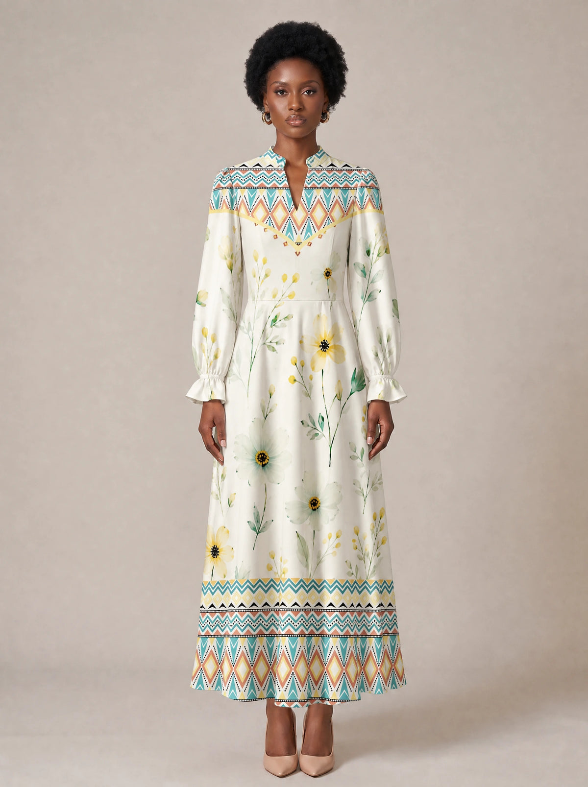 "Alizeti" Long Puff Sleeve Dress — standing, angled view on model