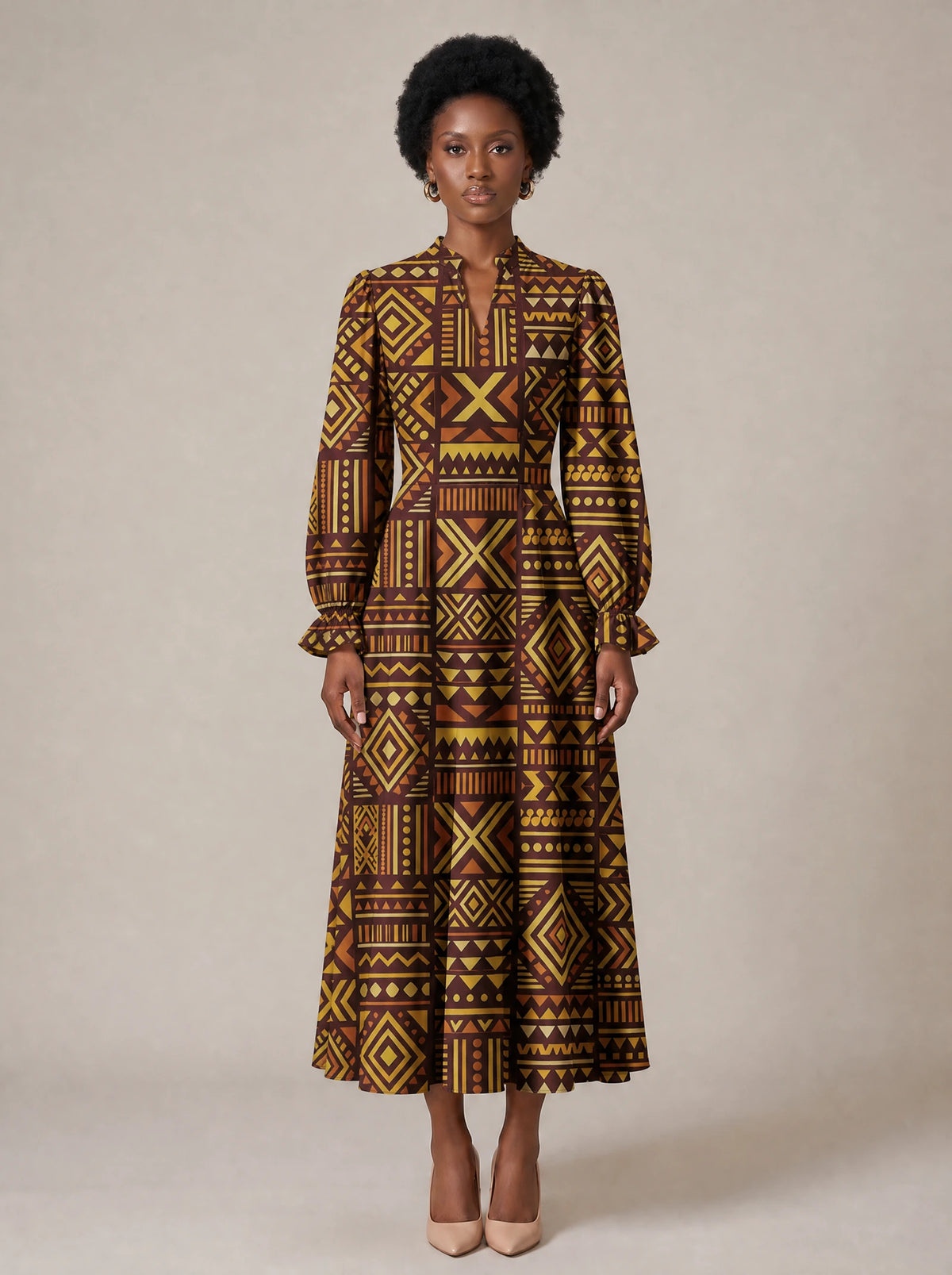 "Mudcloth" Long Puff Sleeve Dress — standing, angled view on model