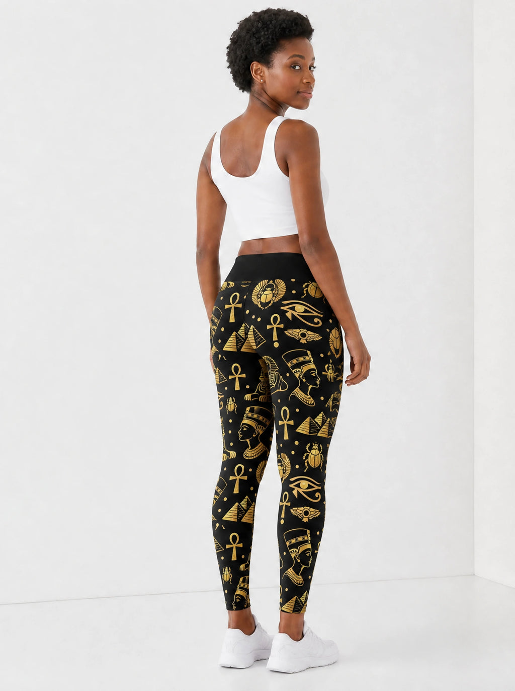"Nefertiti" Black Gold Leggings — back view on model