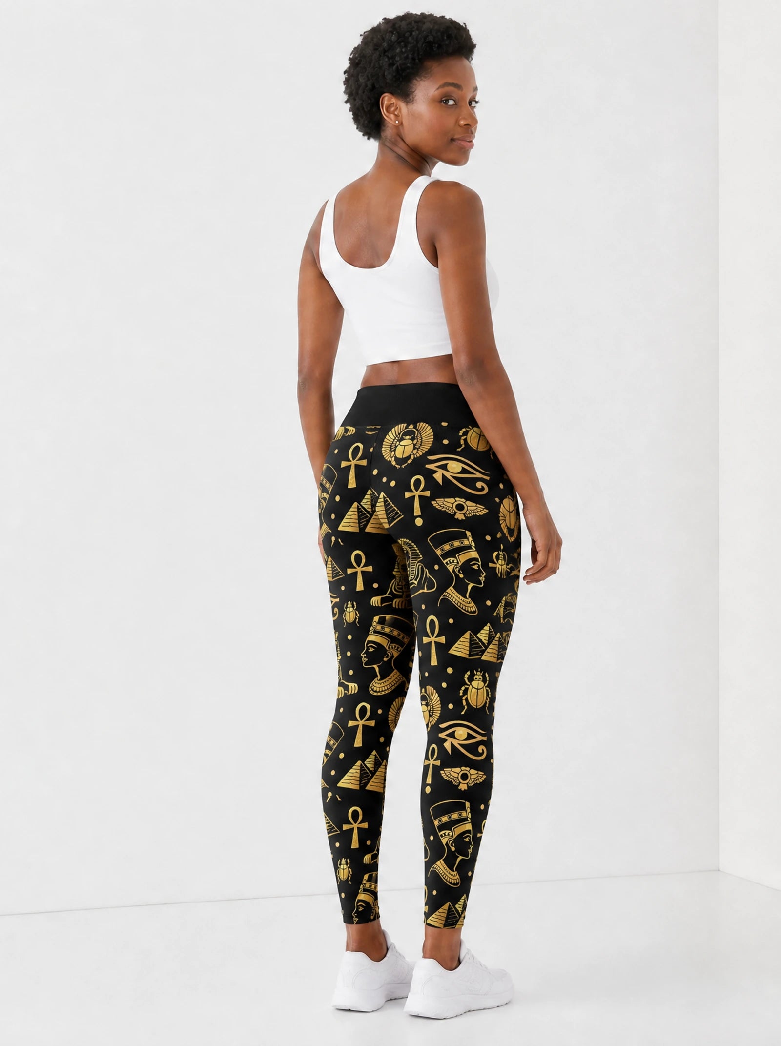 "Nefertiti" Black Gold Leggings — back view on model