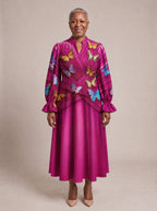 "Kipepeo" Long Puff Sleeve Dress — standing, angled view on model