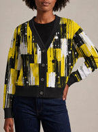 "Mvua" Cardigan — close view of the V-neck, buttons and ribbed trims