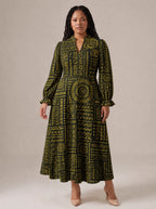 "Lamu" Long Puff Sleeve Dress — standing, angled view on model