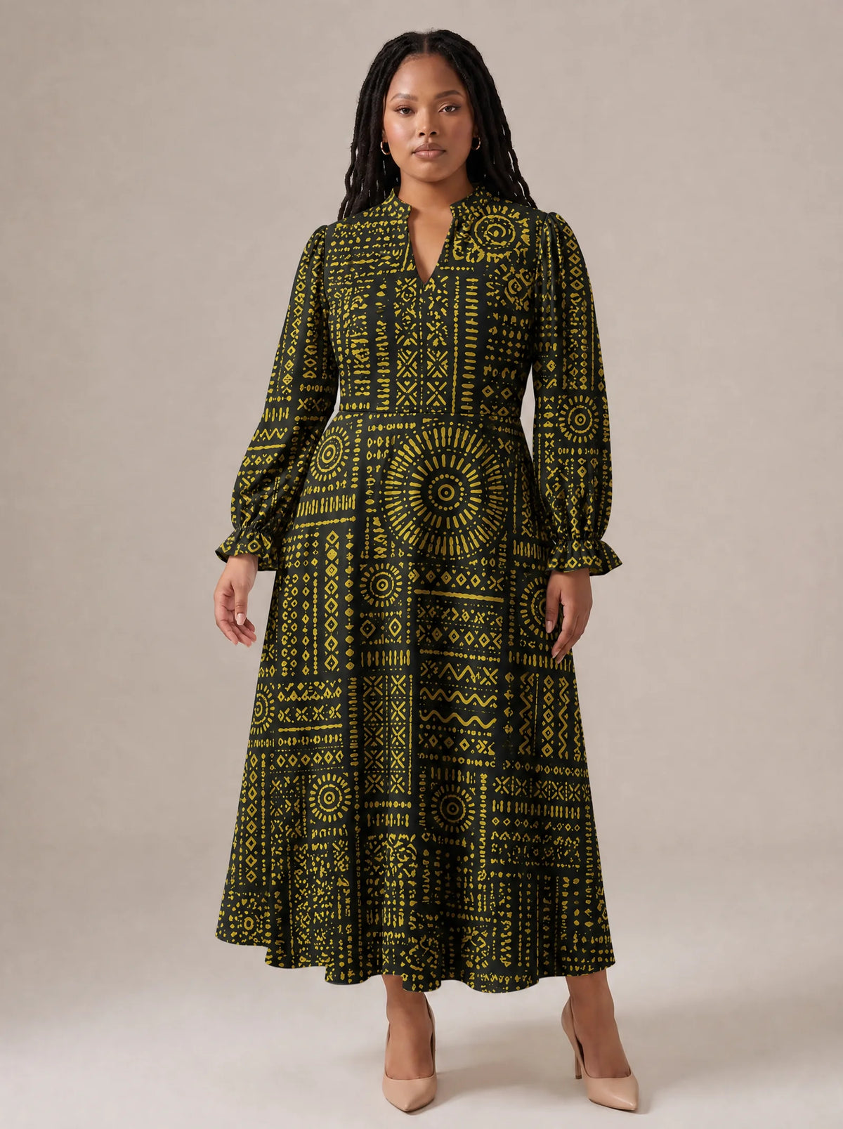 "Lamu" Long Puff Sleeve Dress — standing, angled view on model