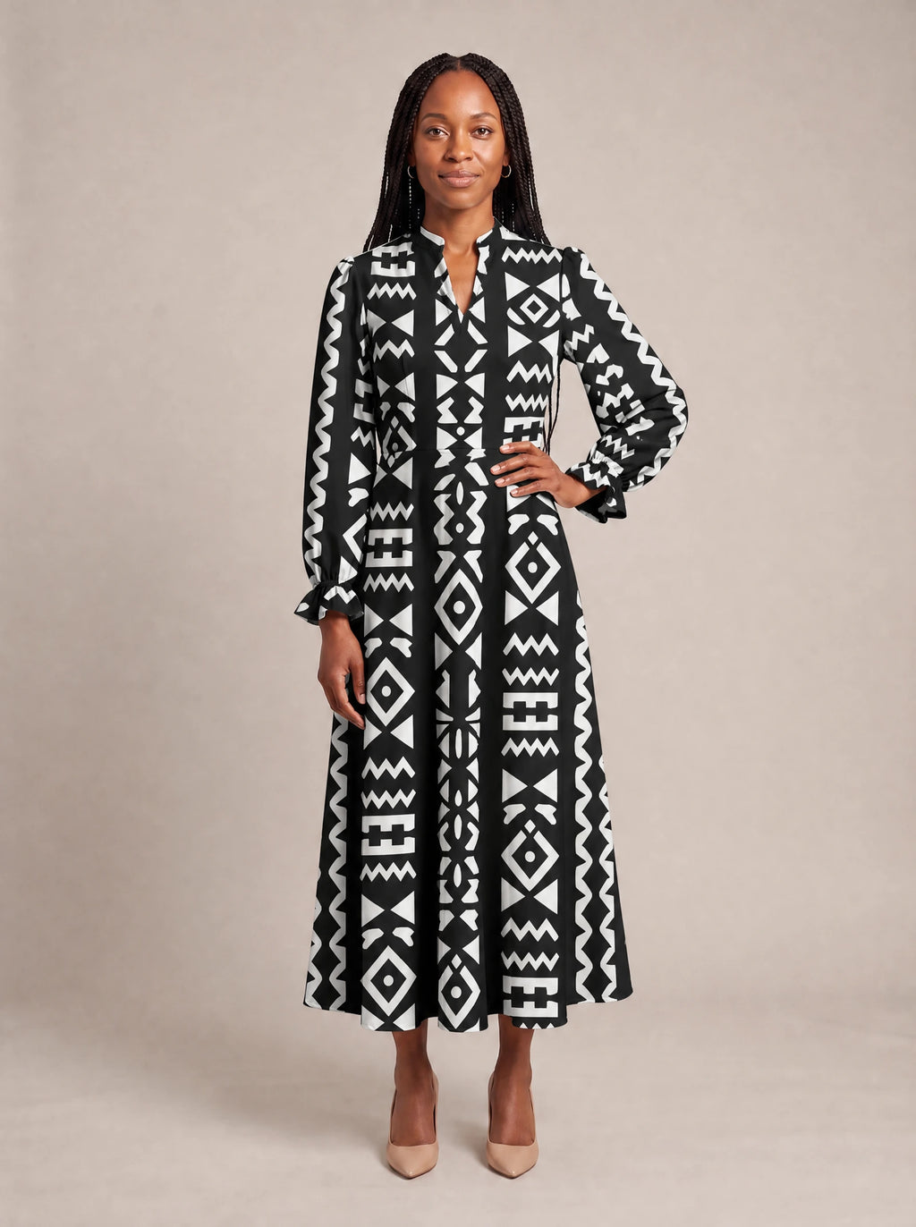 "Kuba" Long Puff Sleeve Dress — standing, angled view on model