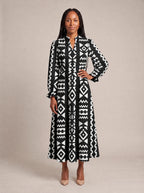 "Kuba" Long Puff Sleeve Dress — standing, angled view on model