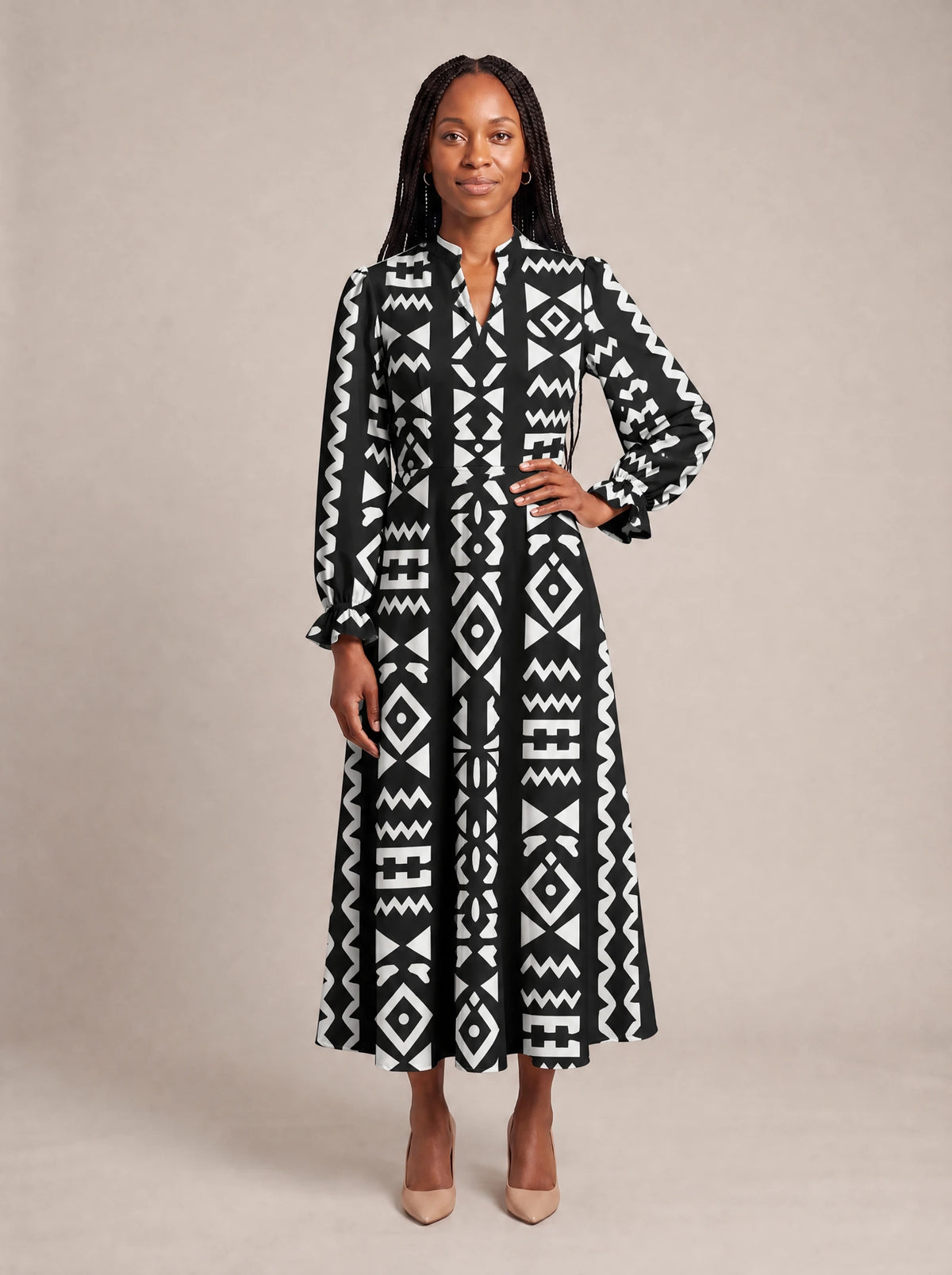 "Kuba" Long Puff Sleeve Dress — standing, angled view on model