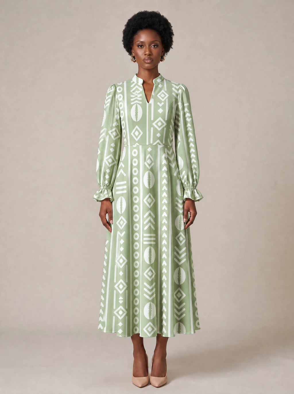 "Oshun Verde" Long Puff Sleeve Dress — standing, angled view on model