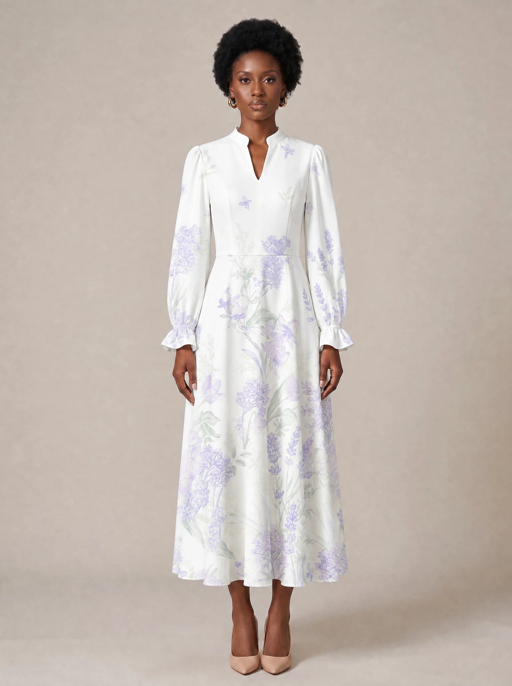 "Urujuani" Long Puff Sleeve Dress — standing, angled view on model