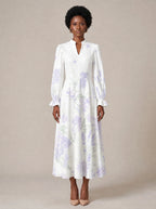 "Urujuani" Long Puff Sleeve Dress — standing, angled view on model
