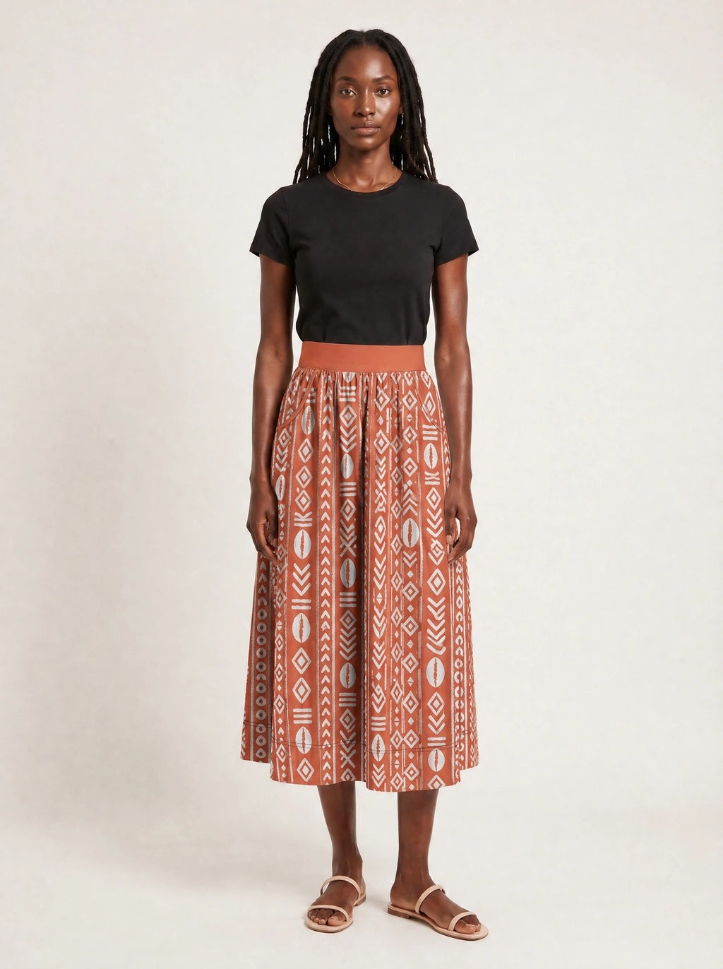 "Oshun Kijani" Twirl Skirt — front view on model