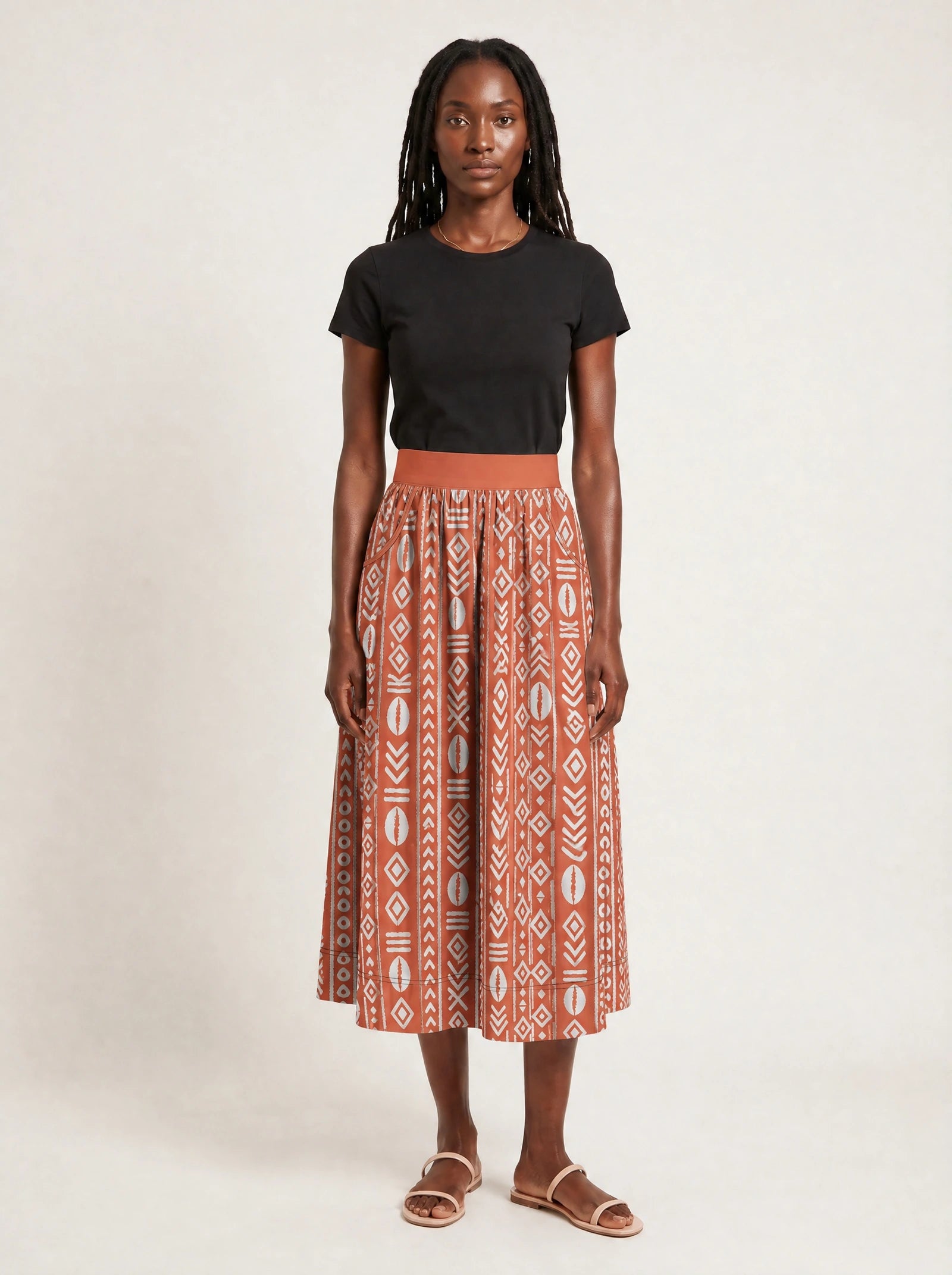 "Oshun Kijani" Twirl Skirt — front view on model