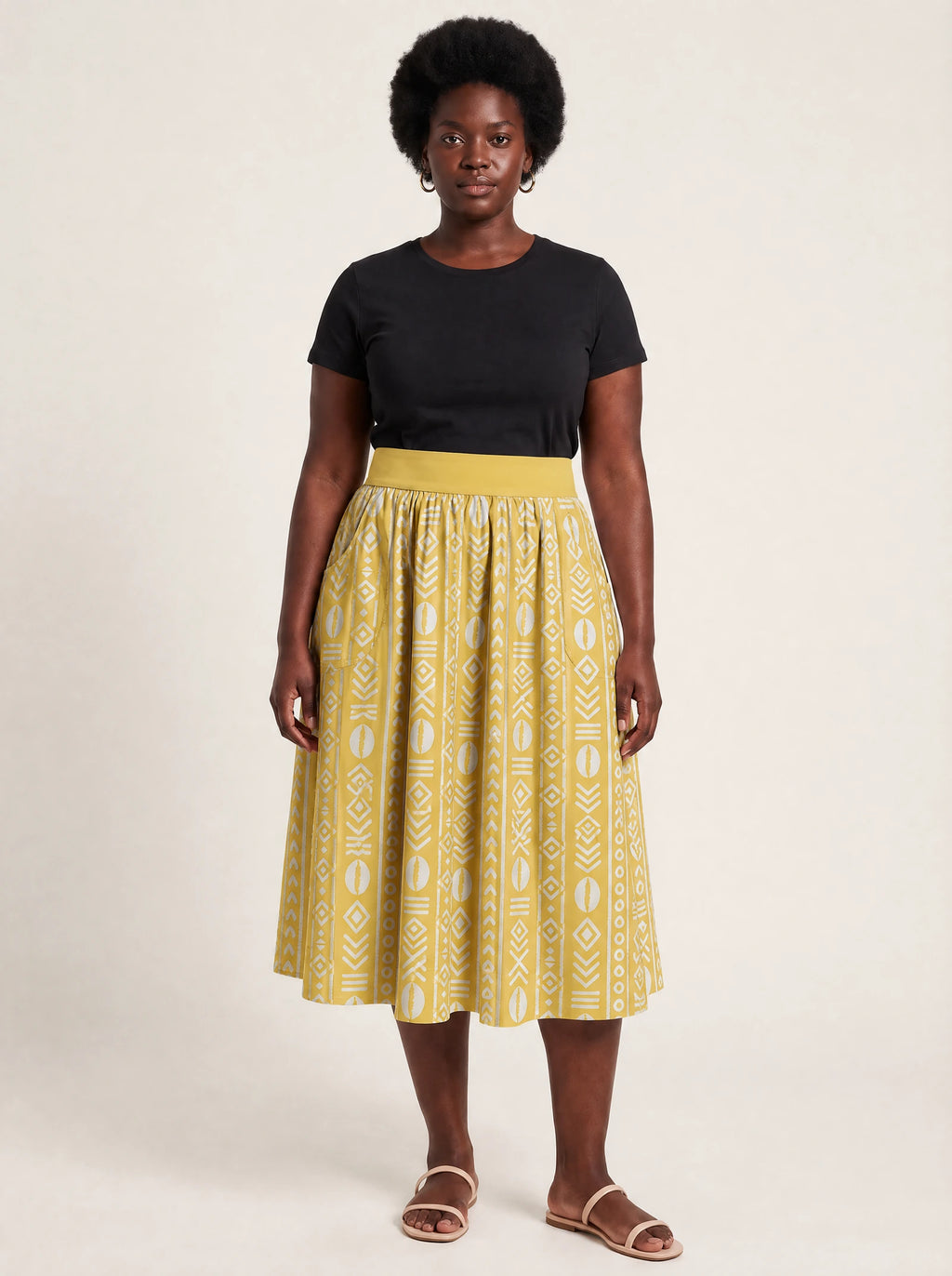 "Oshun Dhahabu" Twirl Skirt — front view on model