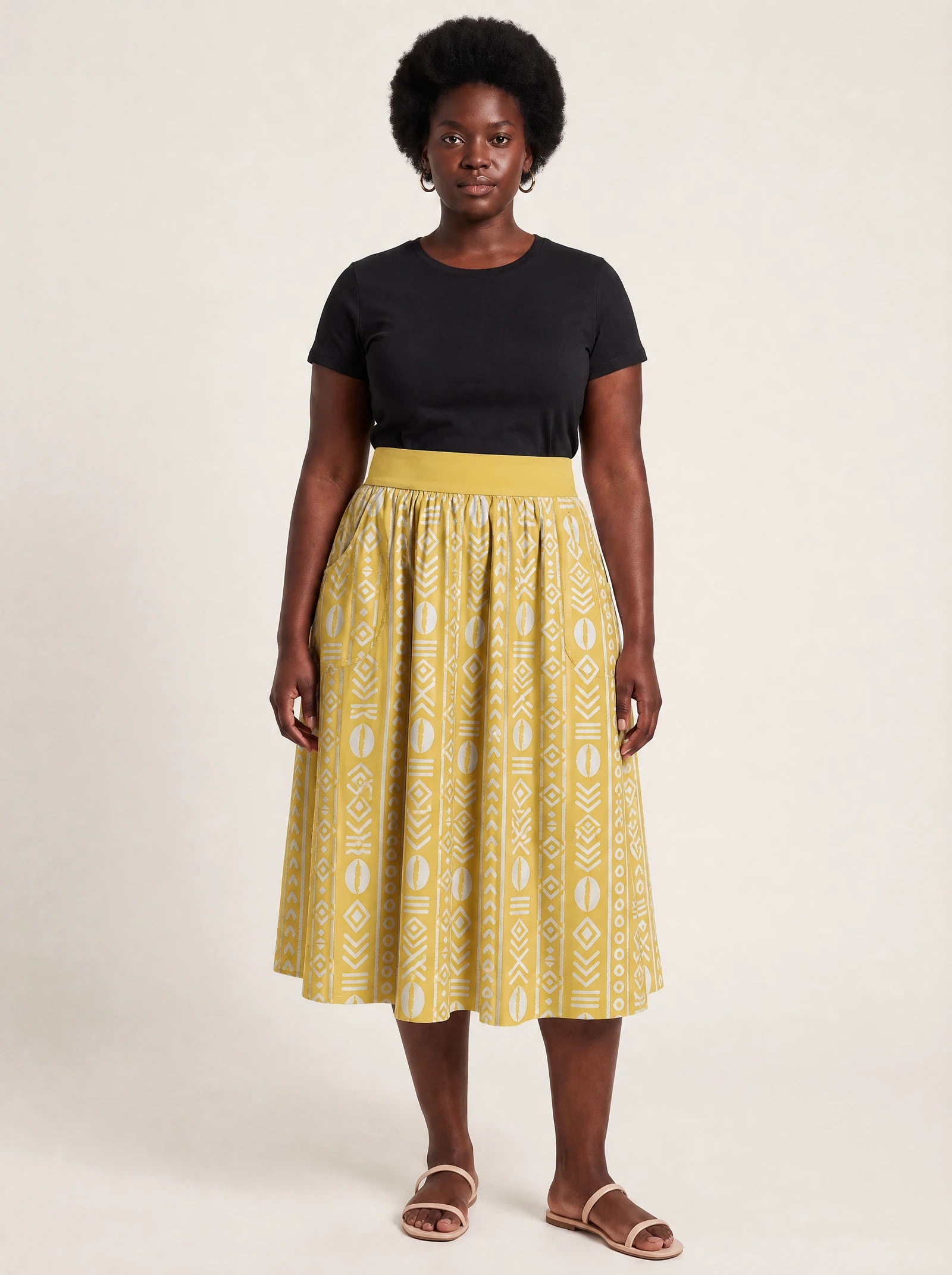 "Oshun Dhahabu" Twirl Skirt — front view on model