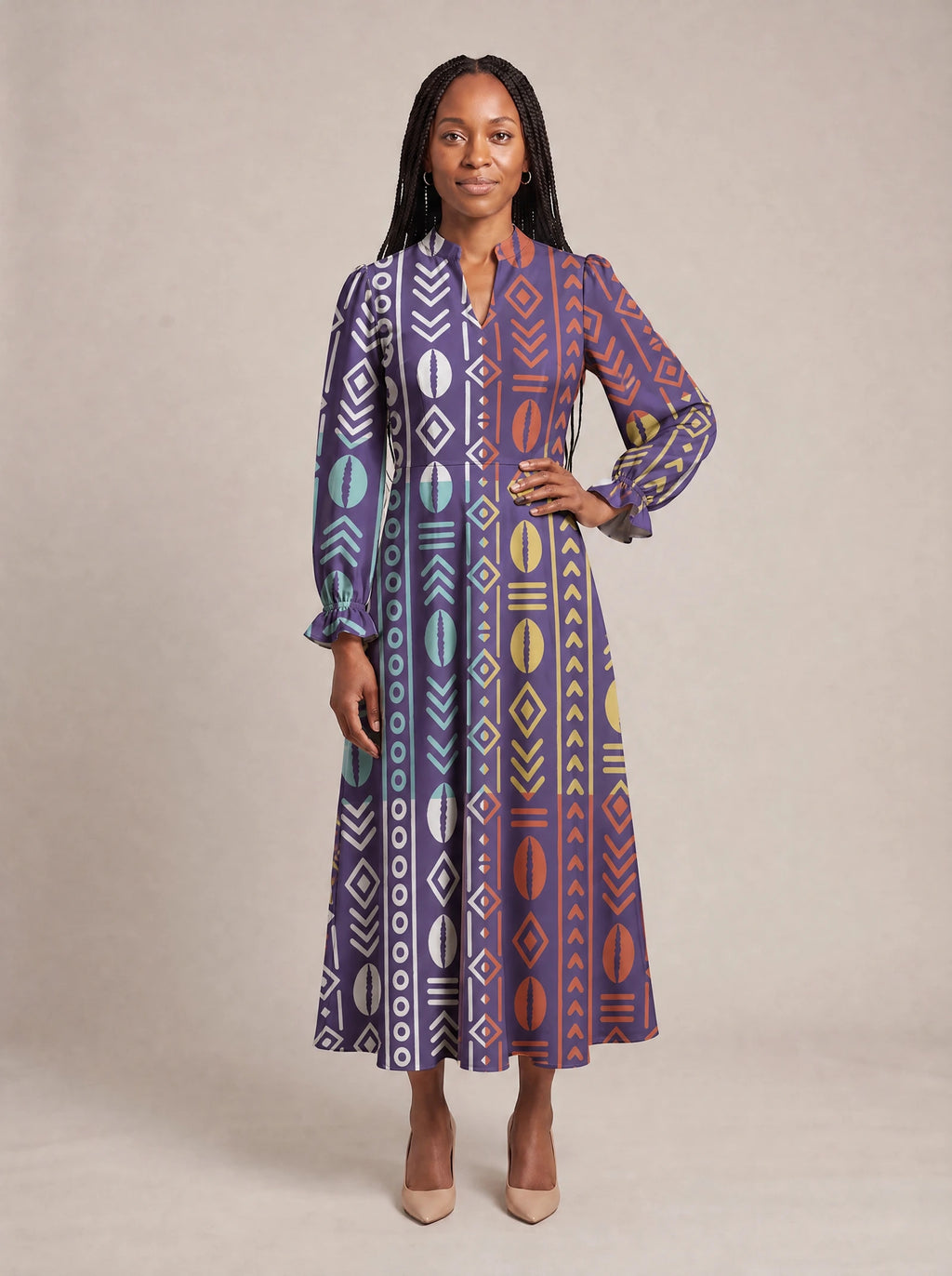 "Oshun Zamani" Long Puff Sleeve Dress — standing, angled view on model