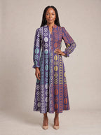 "Oshun Zamani" Long Puff Sleeve Dress — standing, angled view on model