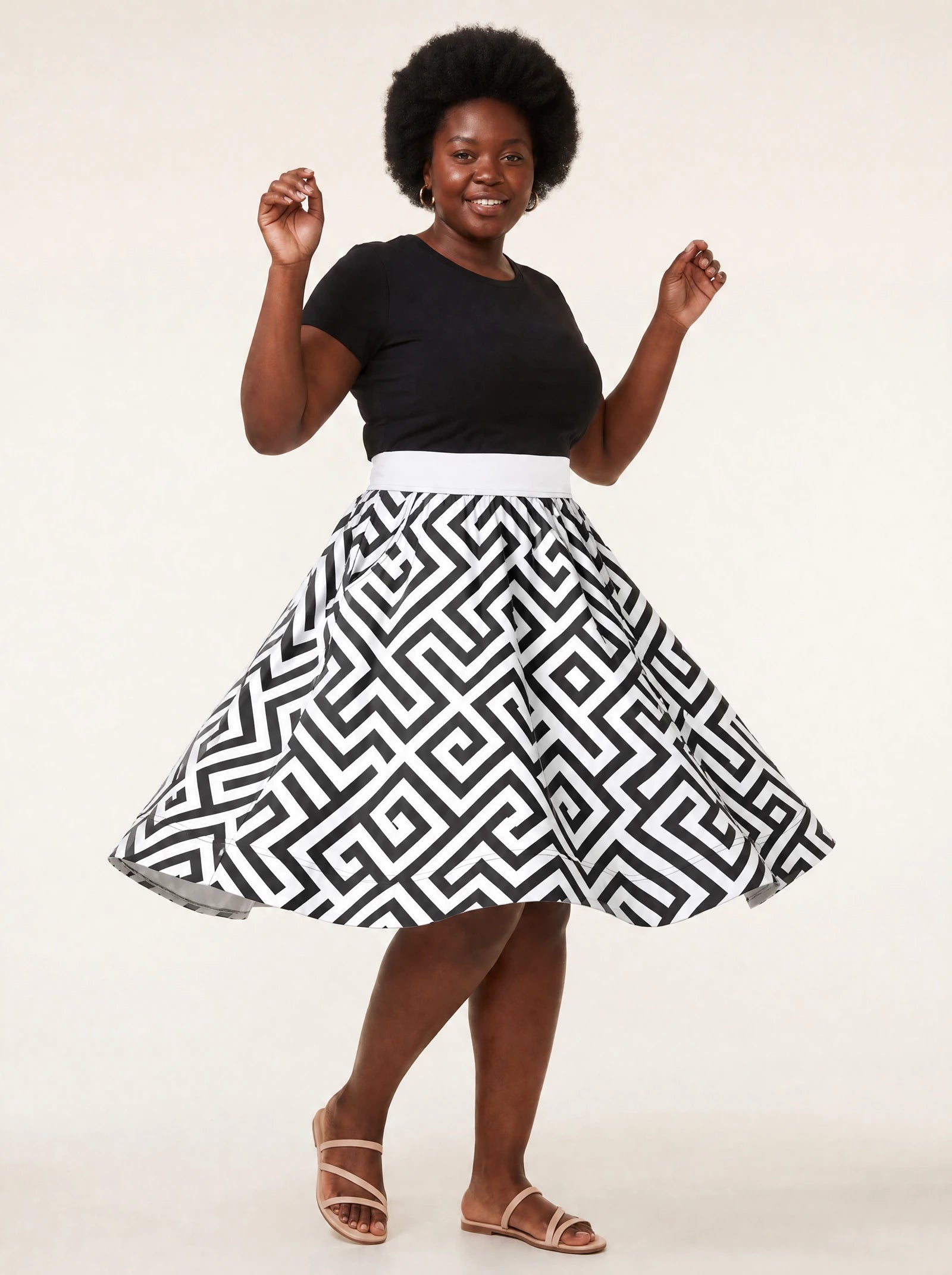 "Zamu" Twirl Skirt — twirling, skirt flared out
