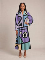 "Sanaa" Long Puff Sleeve Dress — standing, angled view on model
