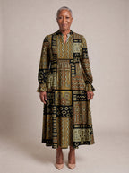 "Sankofa" Long Puff Sleeve Dress — standing, angled view on model