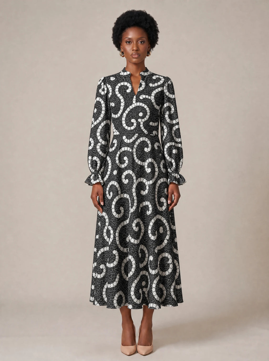 "Duara" Long Puff Sleeve Dress — standing, angled view on model