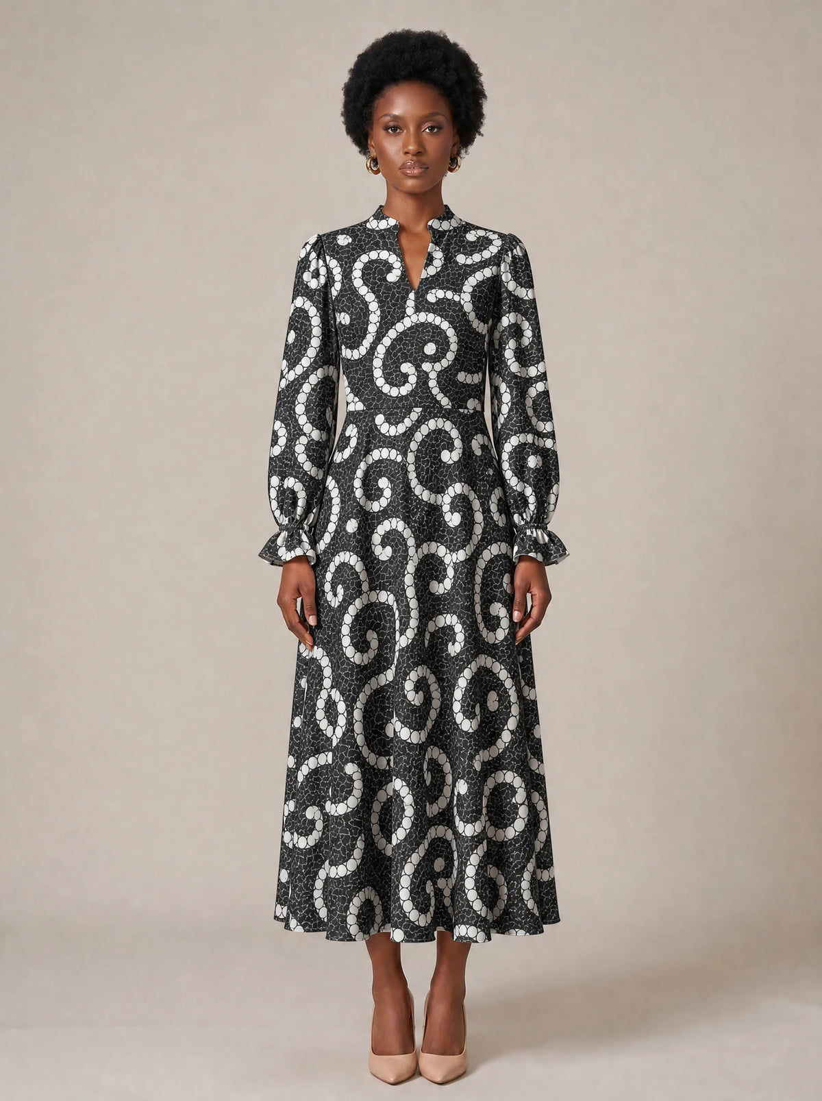 "Duara" Long Puff Sleeve Dress — standing, angled view on model