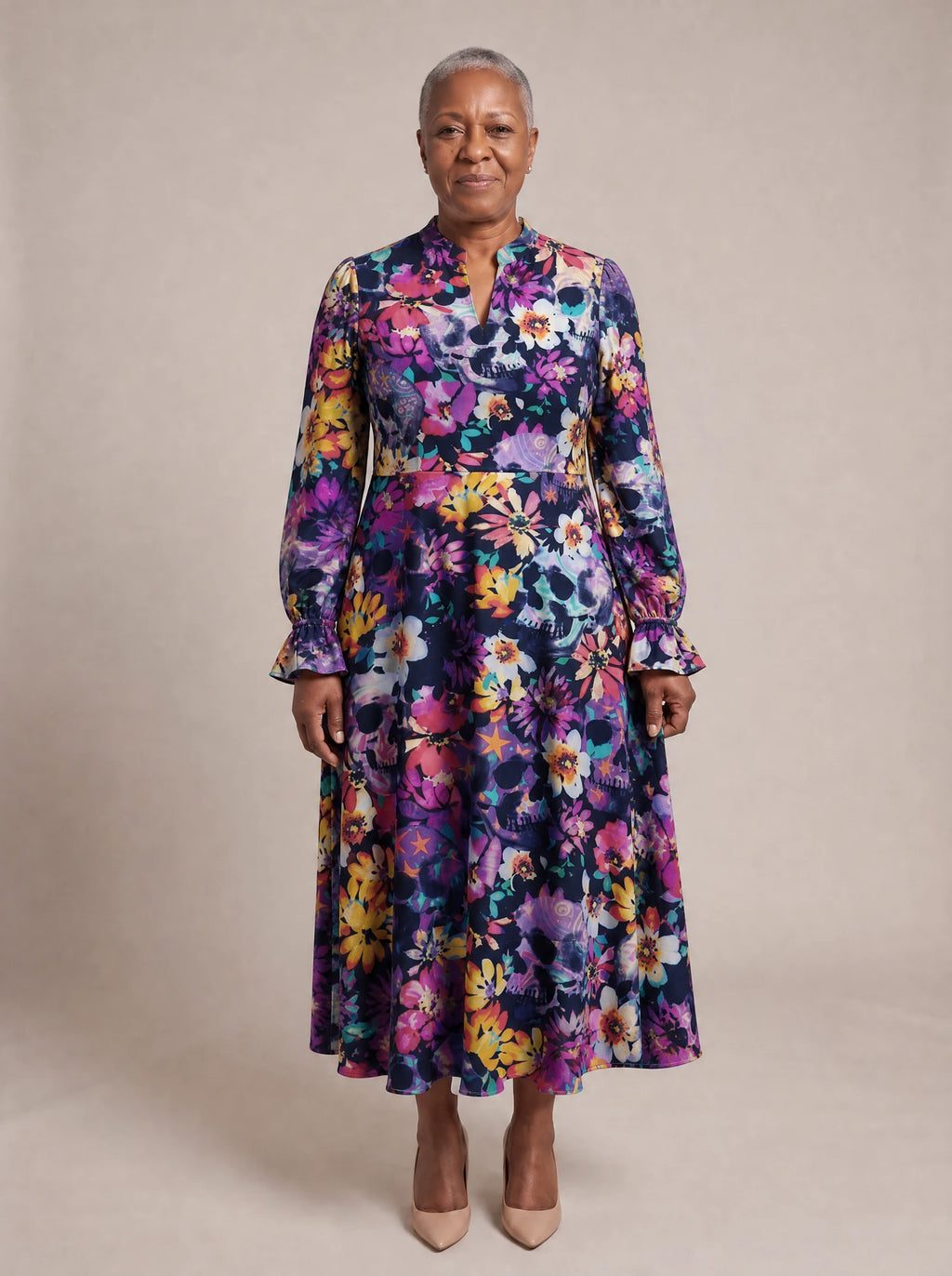 "Njozi" Long Puff Sleeve Dress — standing, angled view on model