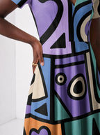 "Sanaa" Short Sleeve Maxi Dress — standing, angled view on model