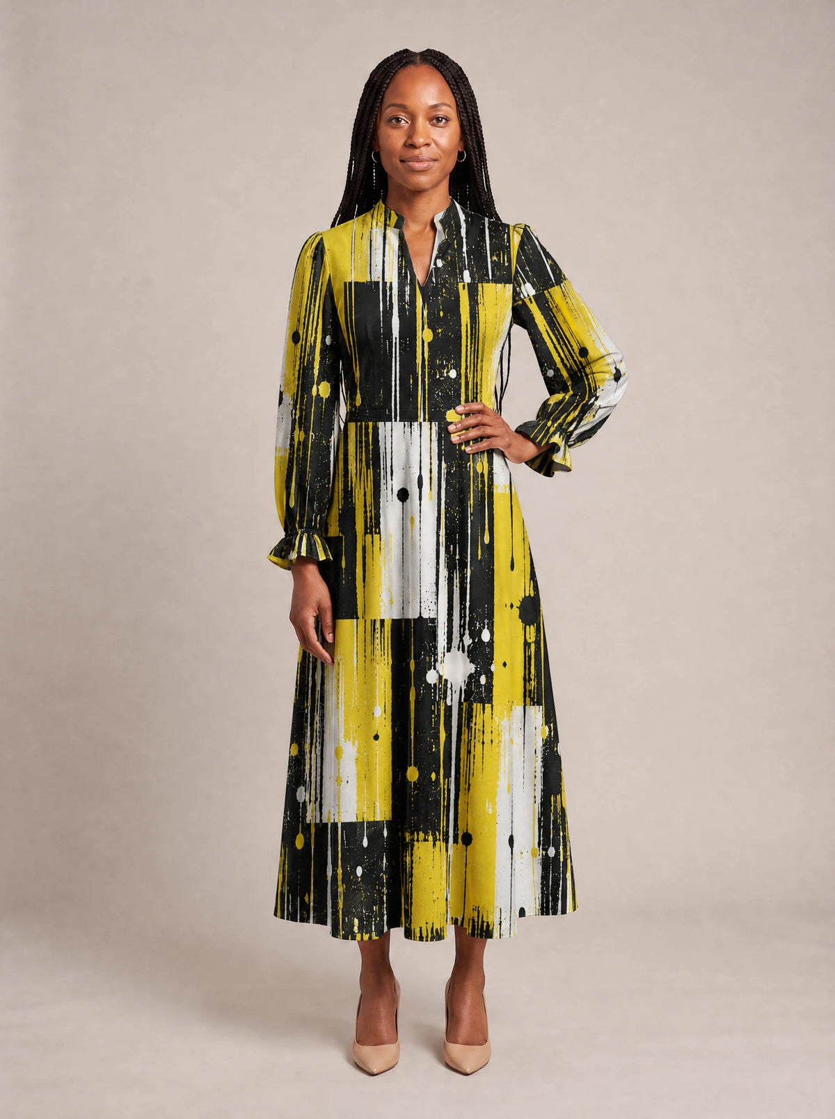 "Mvua" Long Puff Sleeve Dress — standing, angled view on model