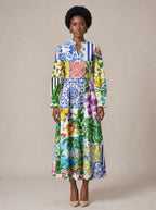 "Kisiwa" Long Puff Sleeve Dress — standing, angled view on model