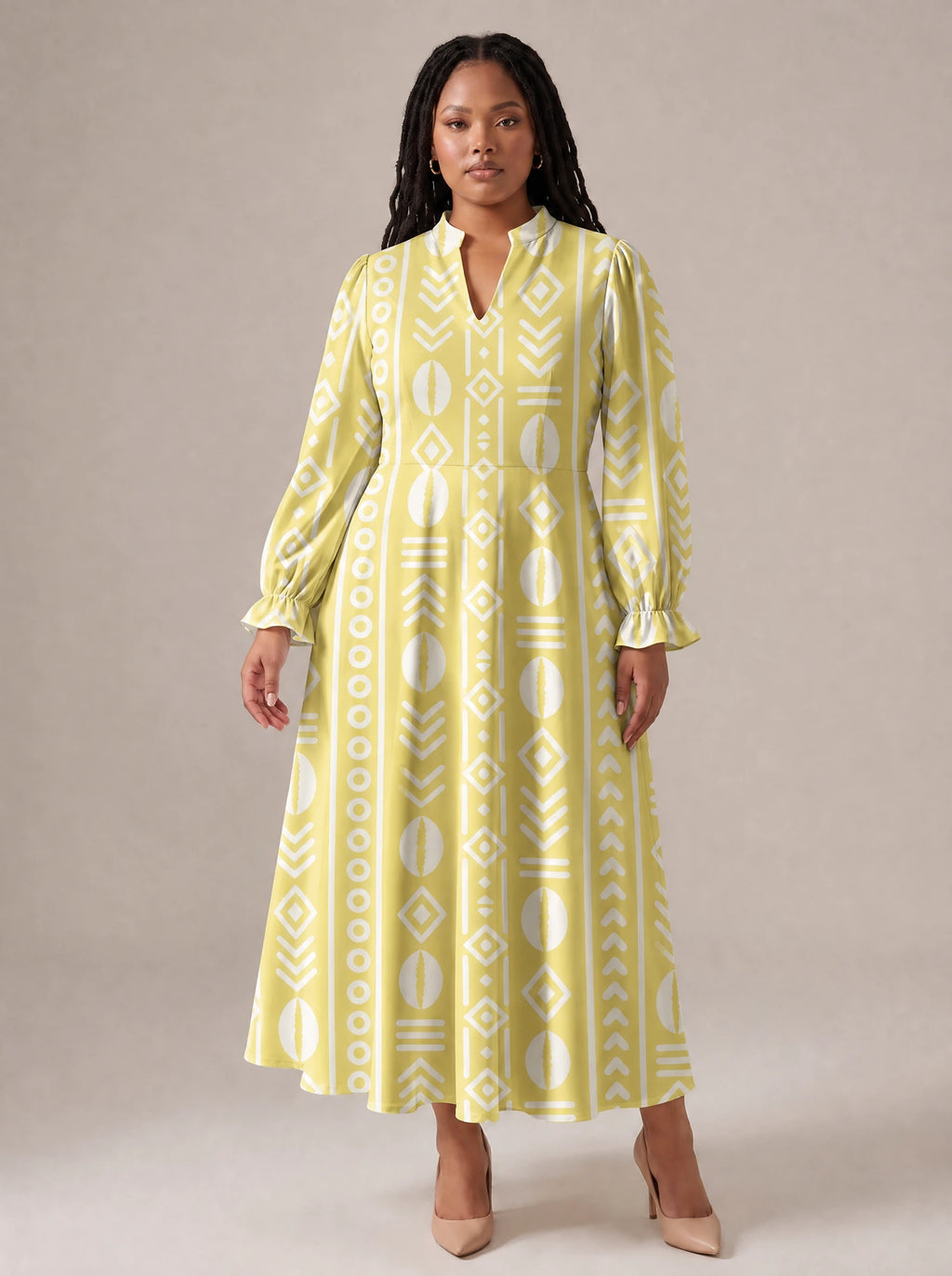"Oshun Dhahabu" Long Puff Sleeve Dress — standing, angled view on model