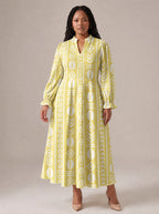 "Oshun Dhahabu" Long Puff Sleeve Dress — standing, angled view on model