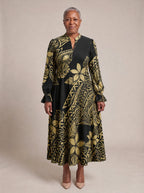"Pualani" Long Puff Sleeve Dress — standing, angled view on model