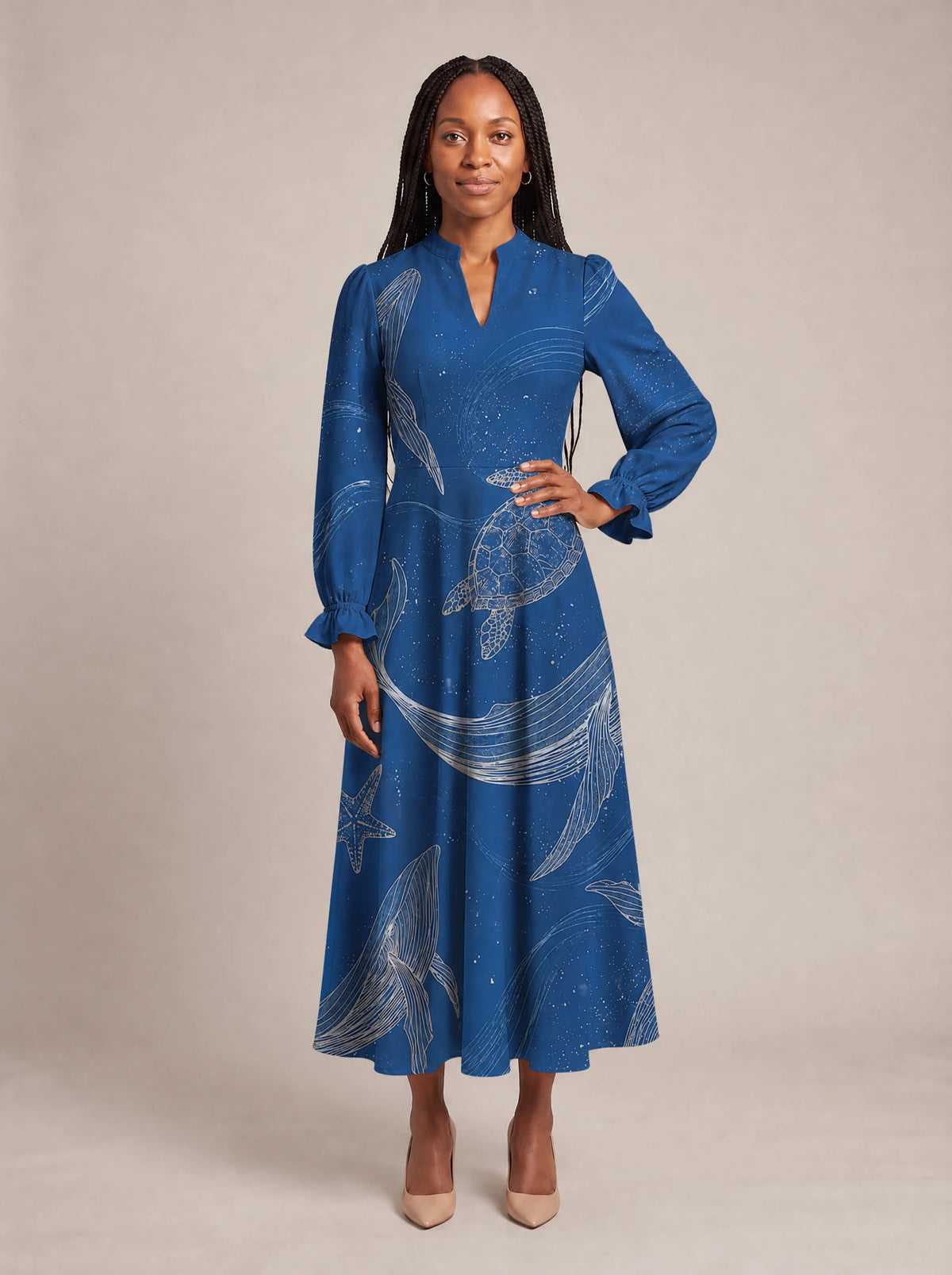 "Pwani" Long Puff Sleeve Dress — standing, angled view on model