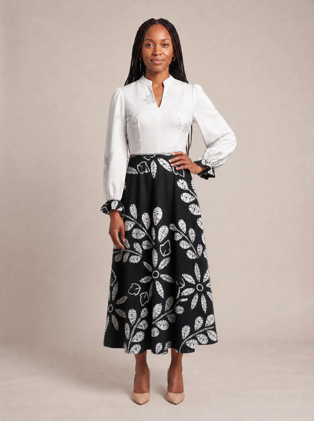 "Kivuli" Long Puff Sleeve Dress — standing, angled view on model