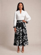"Kivuli" Long Puff Sleeve Dress — standing, angled view on model