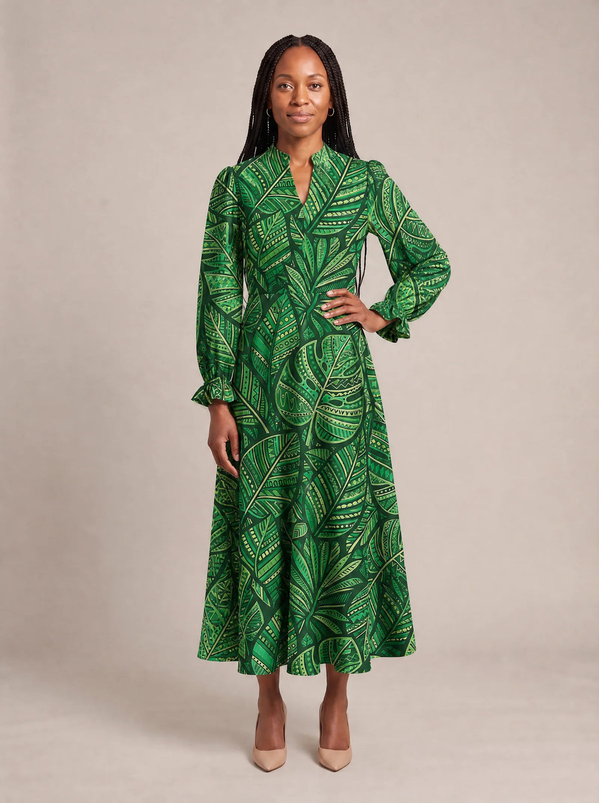 "Asili" Emerald Long Puff Sleeve Dress — standing, angled view on model