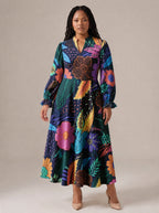 "Bustani" Long Puff Sleeve Dress — standing, angled view on model