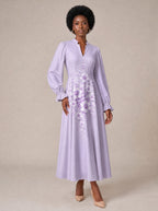 "Zambarau" Long Puff Sleeve Dress — standing, angled view on model
