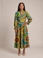 "Taji" Long Puff Sleeve Dress — standing, angled view on model