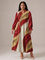 "Utukufu" Long Puff Sleeve Dress — standing, angled view on model
