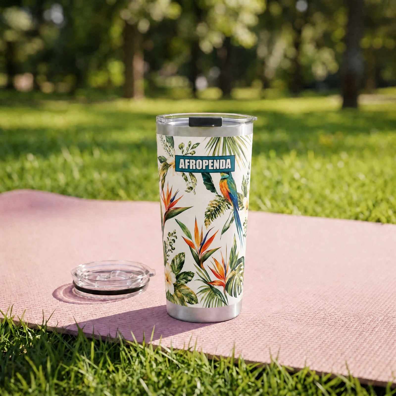 "Ndege" Tumbler — on a yoga mat on a park lawn