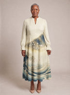 "Wimbi" Long Puff Sleeve Dress — standing, angled view on model